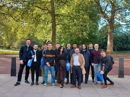 a cohort of those on the Software Development Programme are pictured looking happy in a park.
